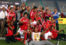 al ahly players celebrate with their trophy after winning their egyptian E7DF45